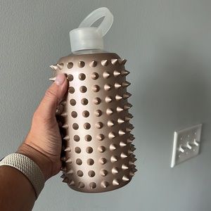 BKR large glass water bottle with gold sleeve